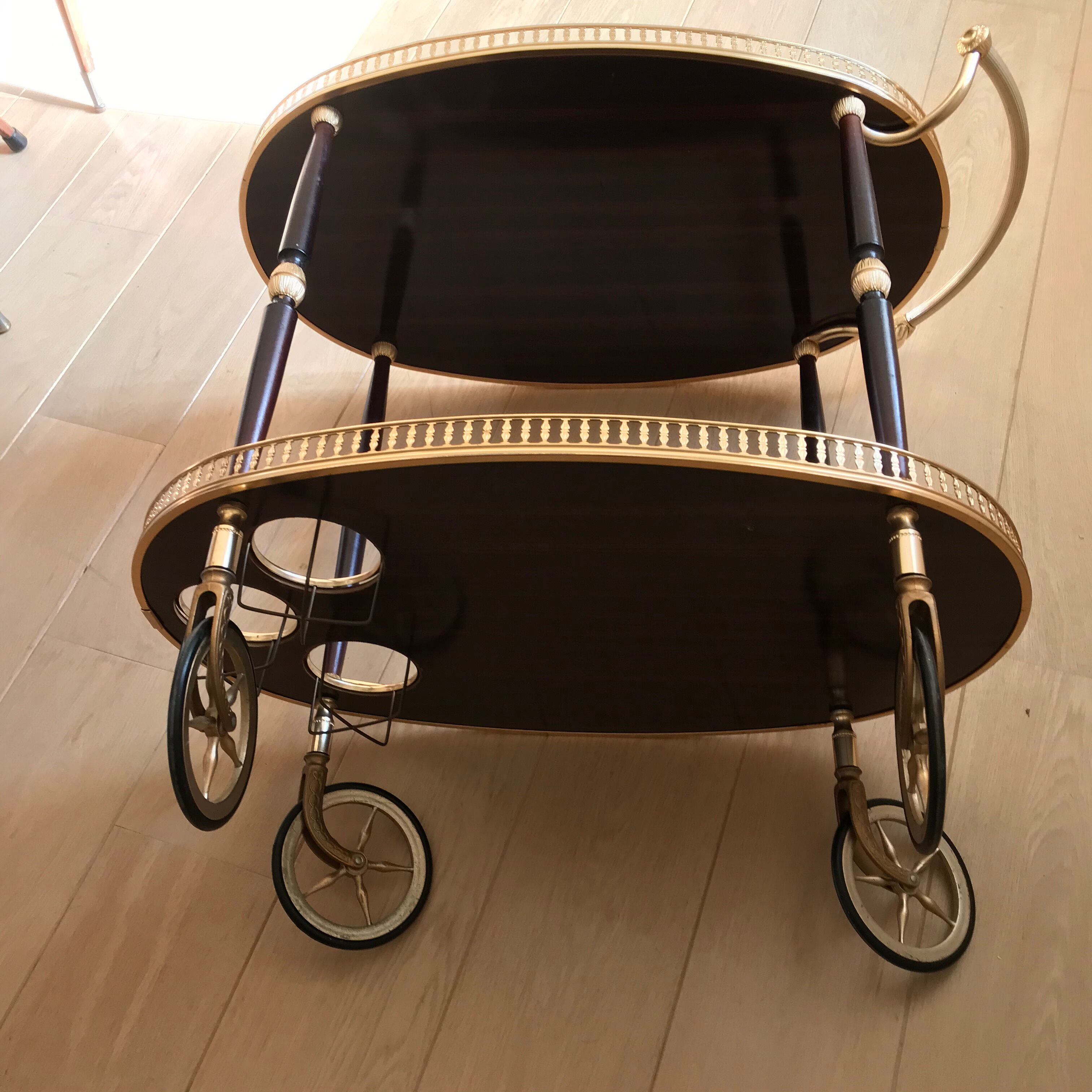 Golden wheeled serving trolley