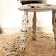 Patinated tripod stool