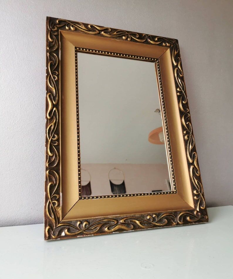 Beautiful French vintage mirror in gilded wood from the 60s