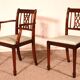 set of 10 chairs and two mahogany armchairs in Hepplewhite style