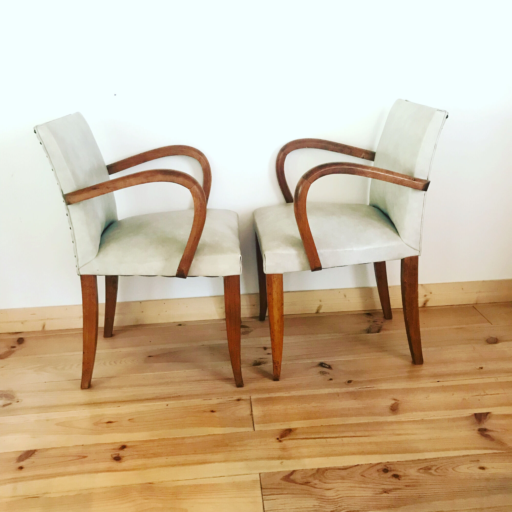 Pair of vintage armchairs in wood and imitation leather