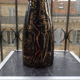 Cerennes workshop vase decorated with gold on a black background