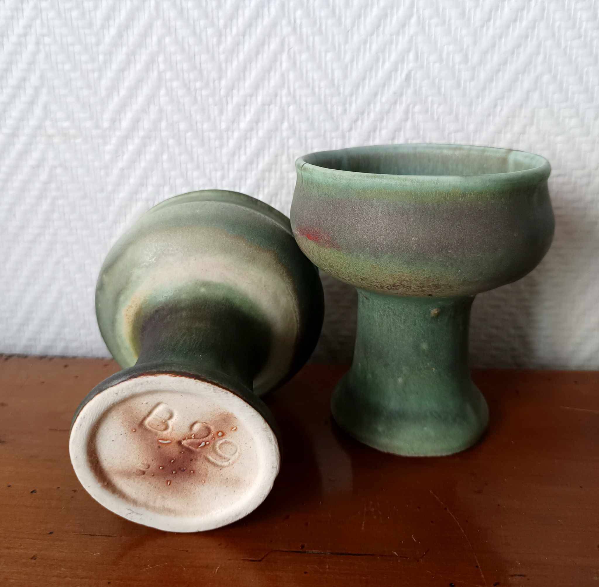 Pair of Belgian ceramic candlesticks on feet
