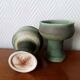Pair of Belgian ceramic candlesticks on feet