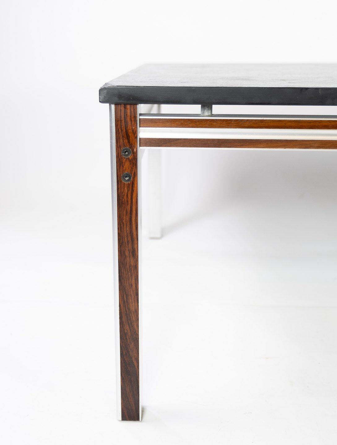 Coffee table with black slate plate and frame in rosewood and metal, of danish design from the 1970s