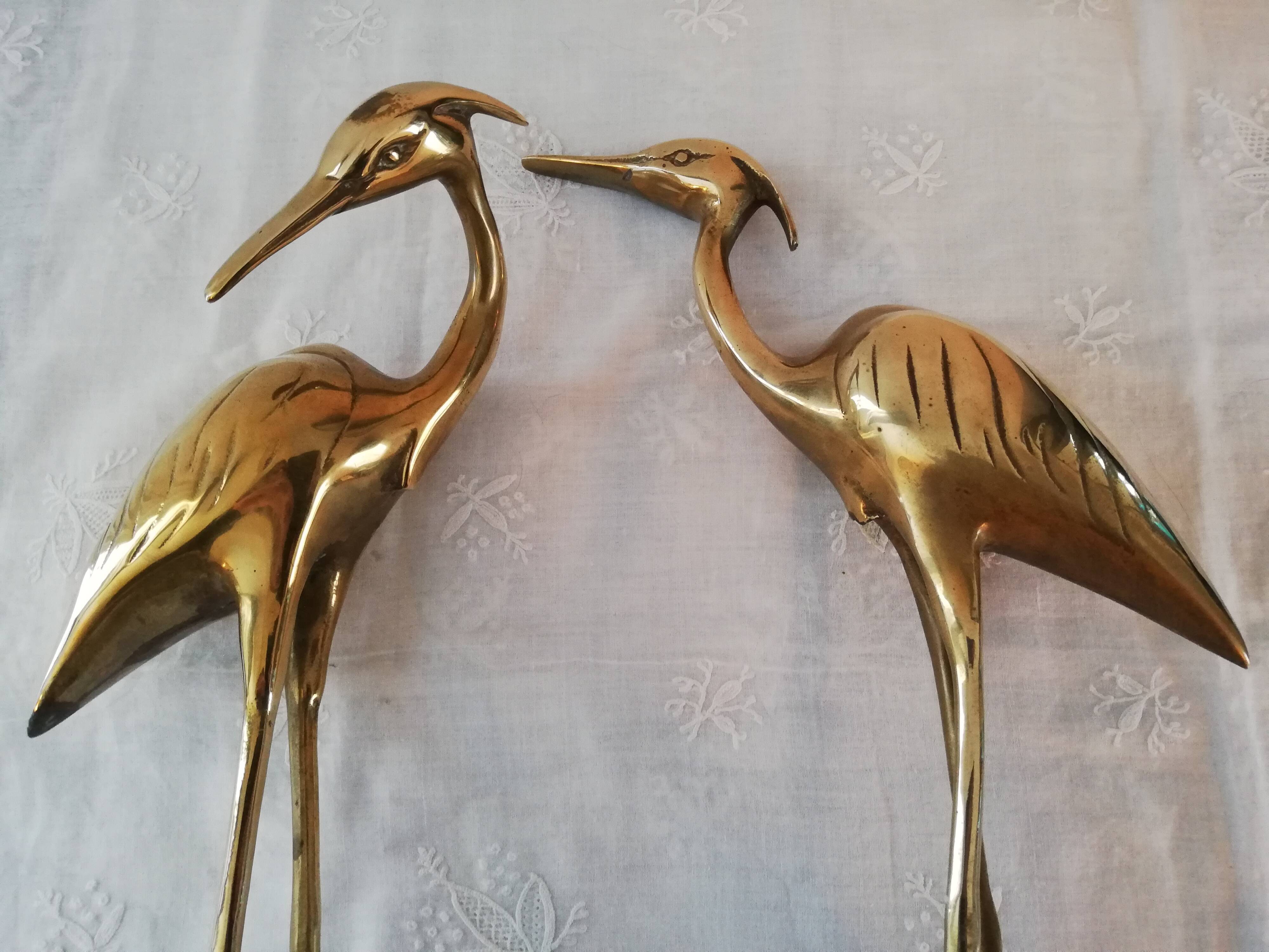 Couple of brass herons