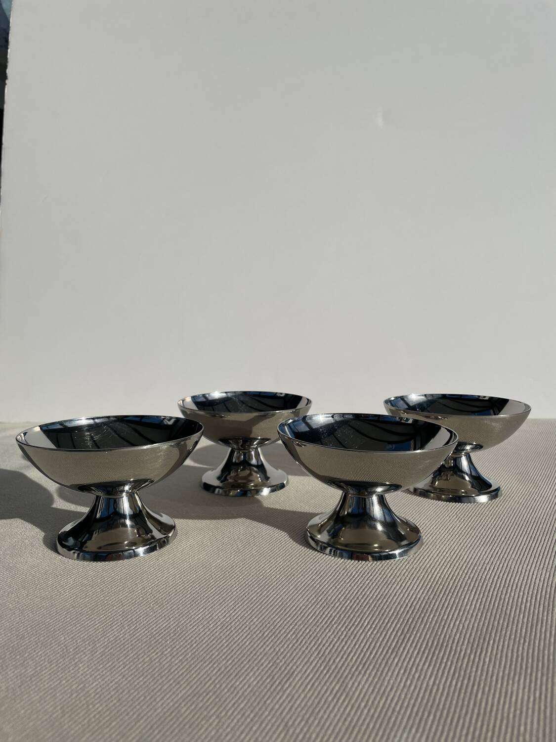 Set of 4 vintage metal ice cream glasses/cups on a stand.