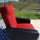 Vintage armchairs in red and black faux leather, the pair.