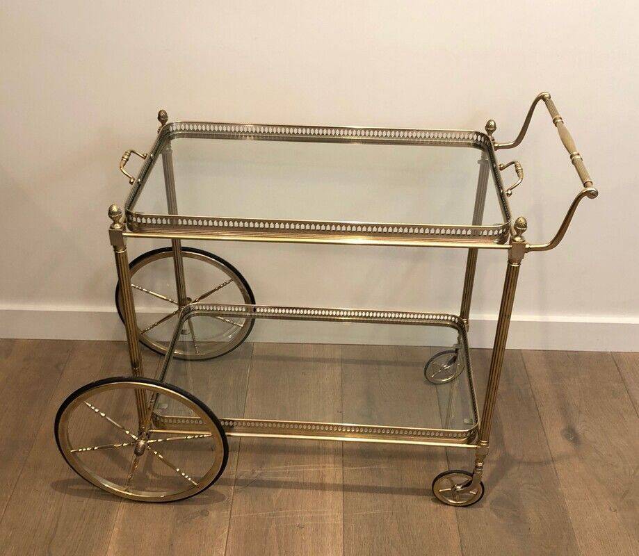 Neoclassical style rolling table in silvered brass