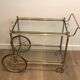 Neoclassical style rolling table in silvered brass