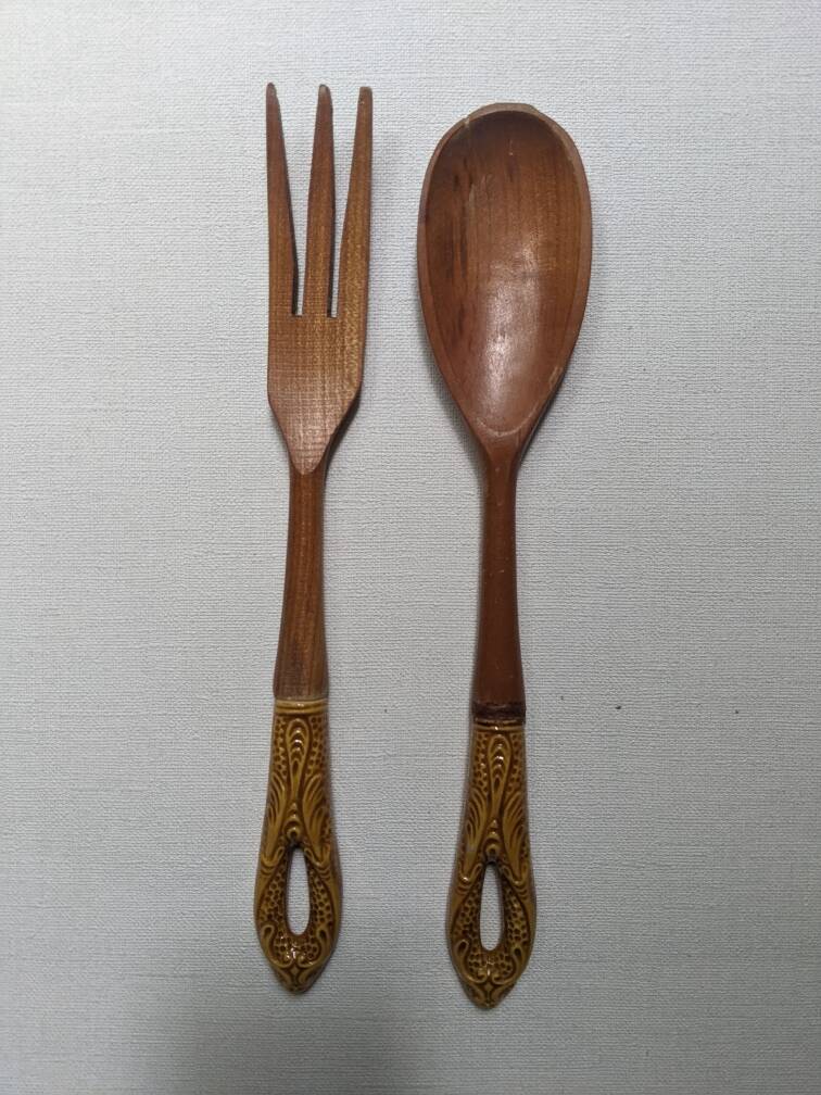 Antique wooden salad servers with earthenware handles, handcrafted
