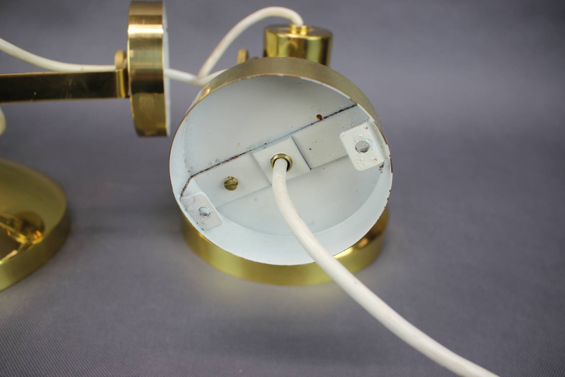 Set of four adjustable brass wall lights, Germany, 1960s.