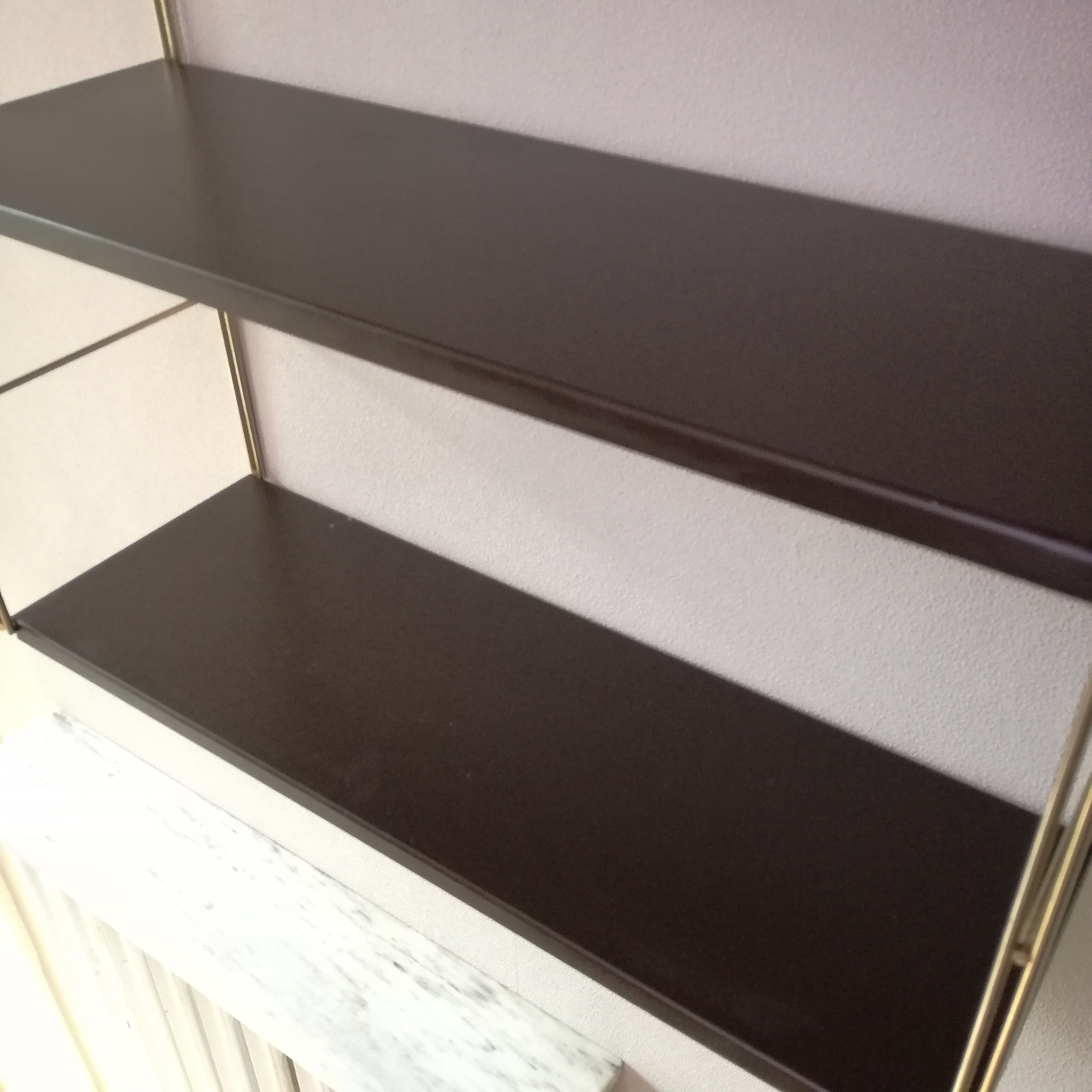Golden and brown stringed shelf in metal