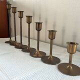 Set of 7 vintage brass candlesticks.