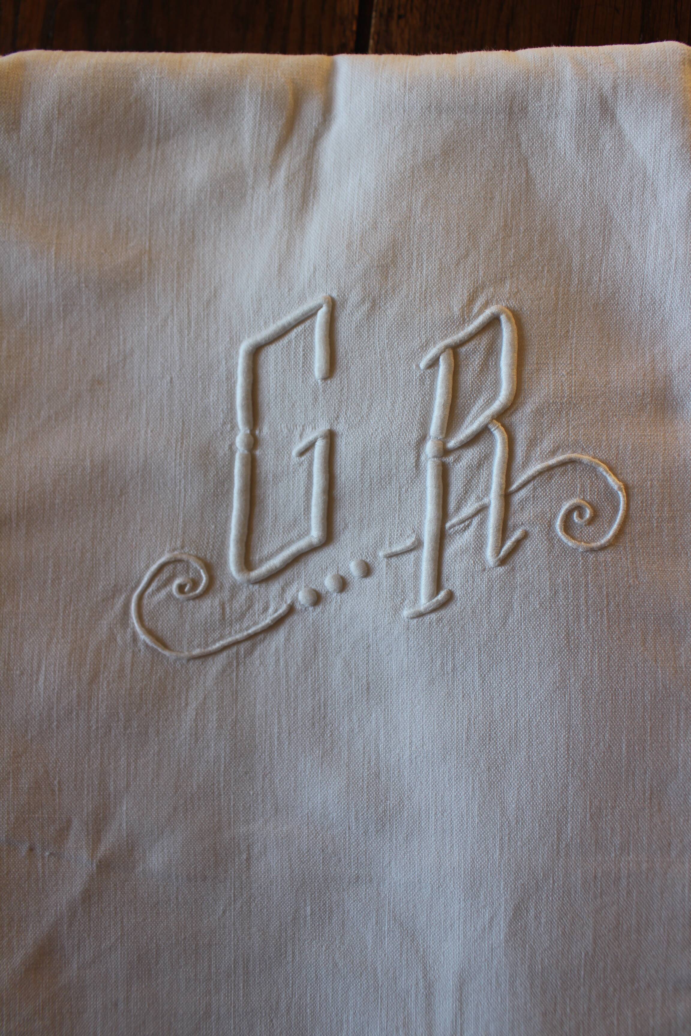 White sheet Monograms G R days scales