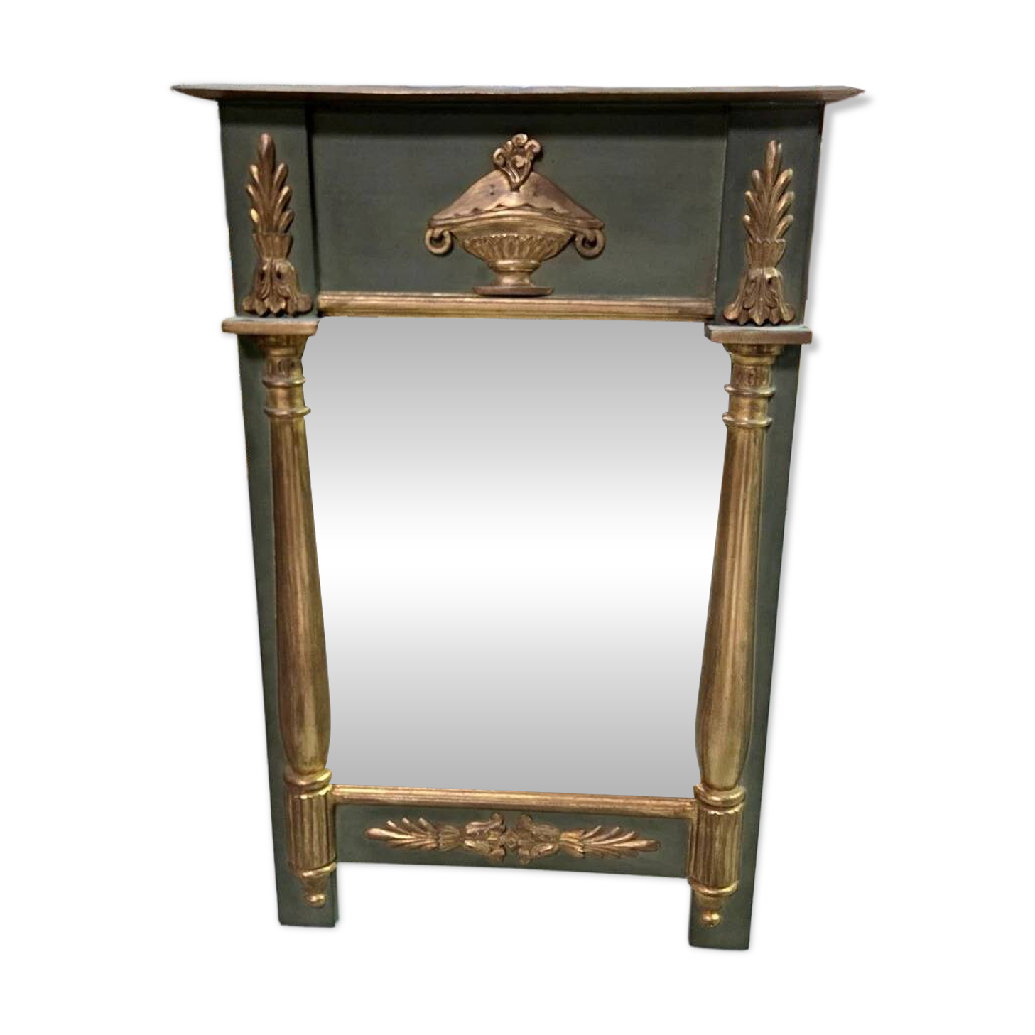 Empire-style mirror in deep green lacquered wood richly enhanced.