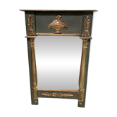 Empire-style mirror in deep green lacquered wood richly enhanced.