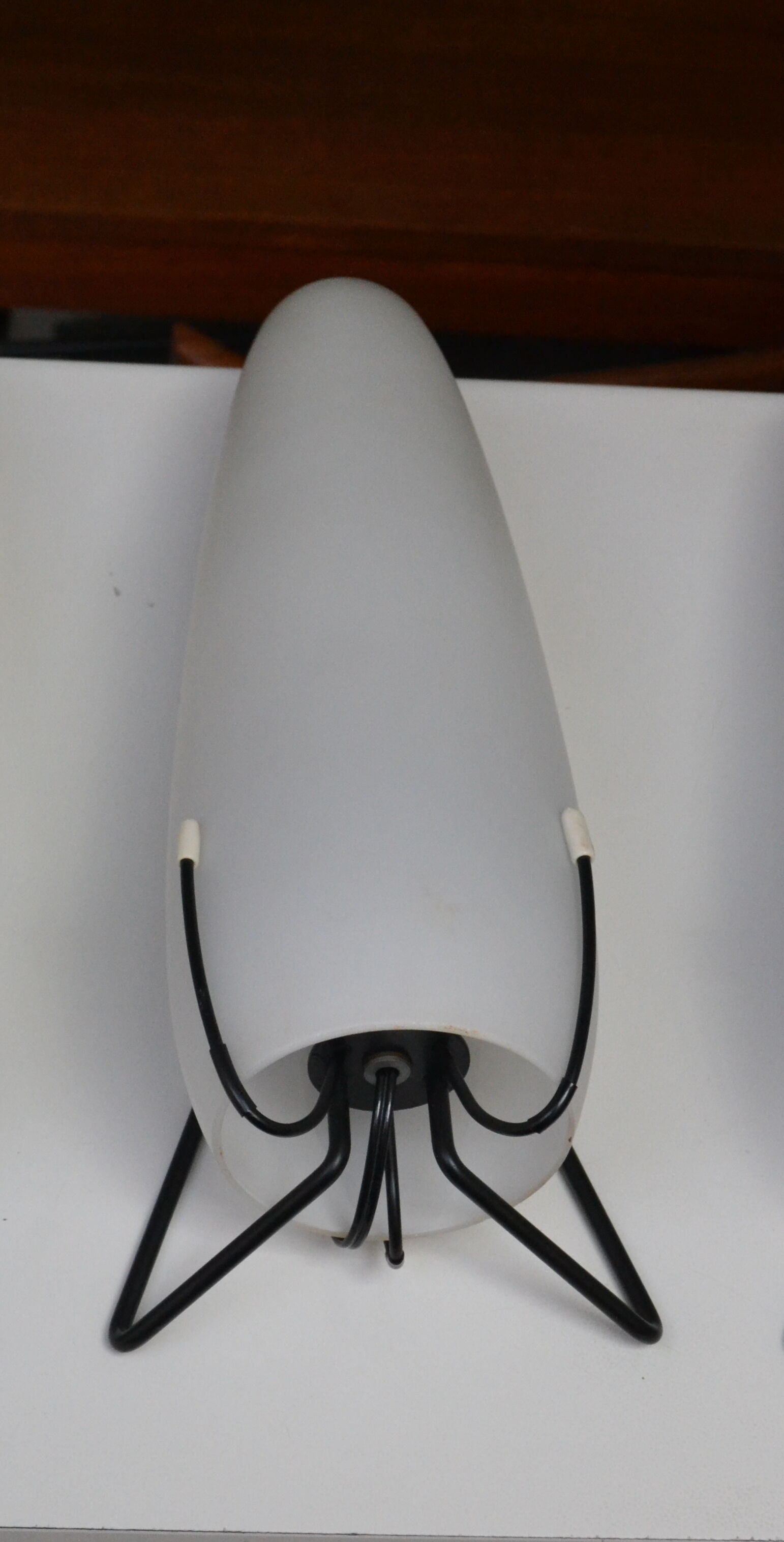 Louis Kalff opaline and metal wall light from the 1950s.