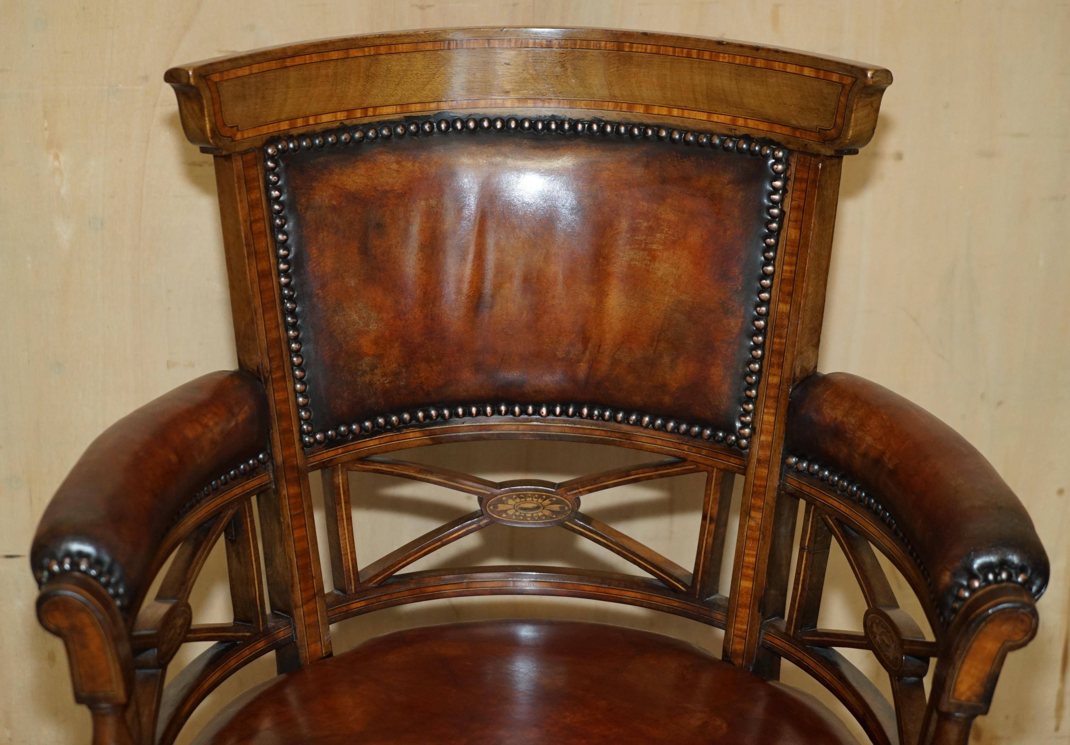Victorian captain's chair in leather restored by Cornelius V Smith.