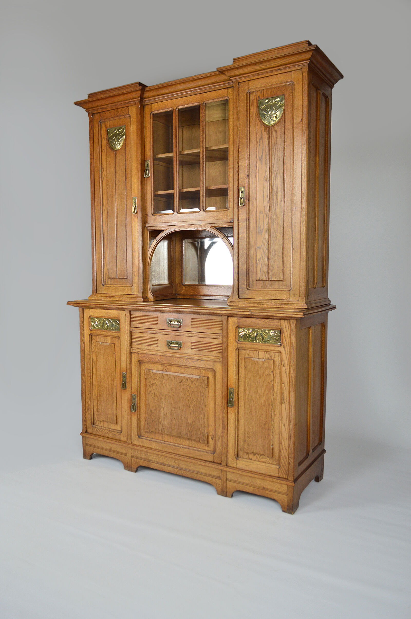 Art Nouveau oak buffet and dinanderie panels, circa 1910