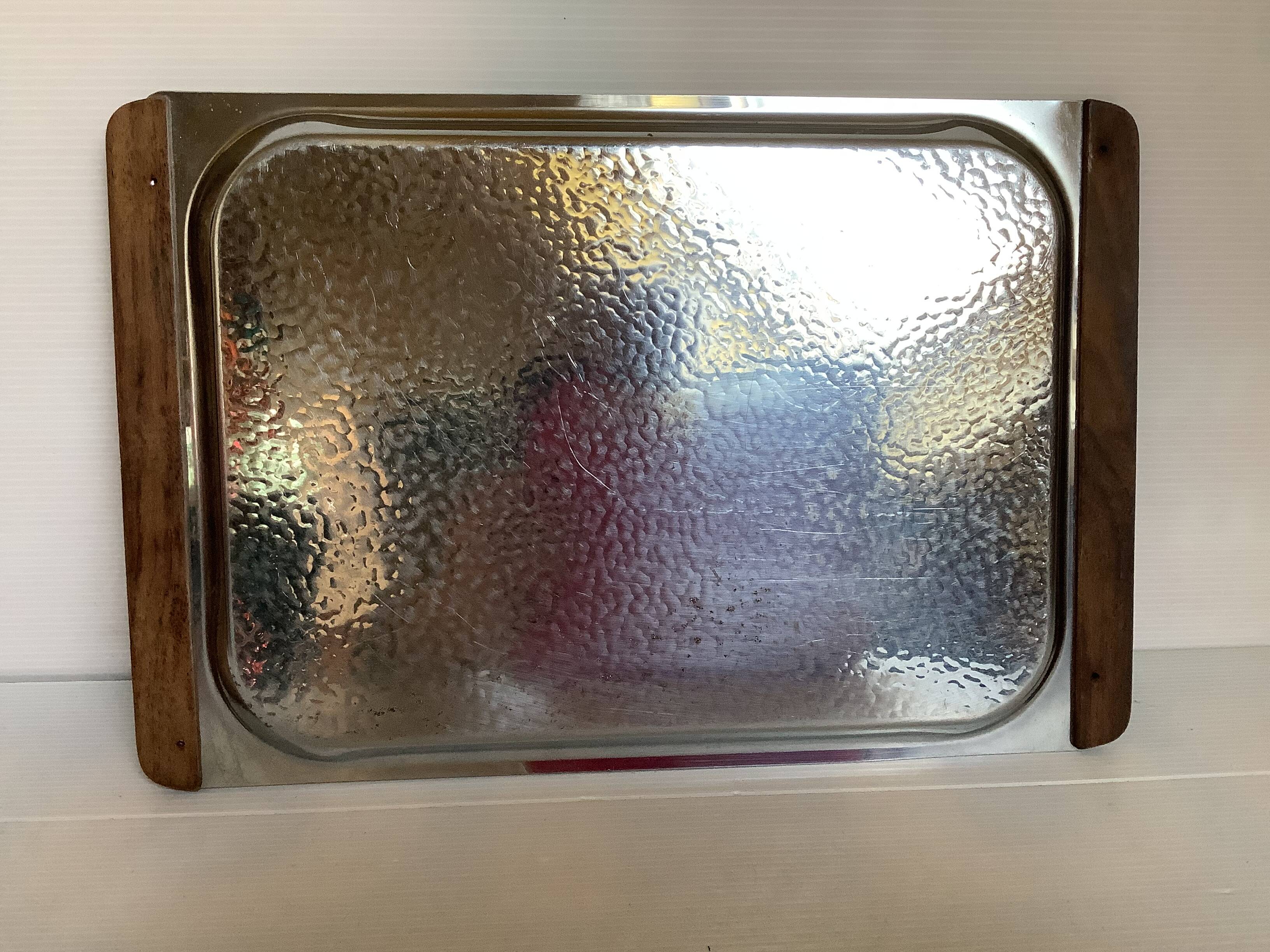 Small hammered metal and wood tray in Scandinavian style.