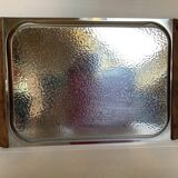 Small hammered metal and wood tray in Scandinavian style.