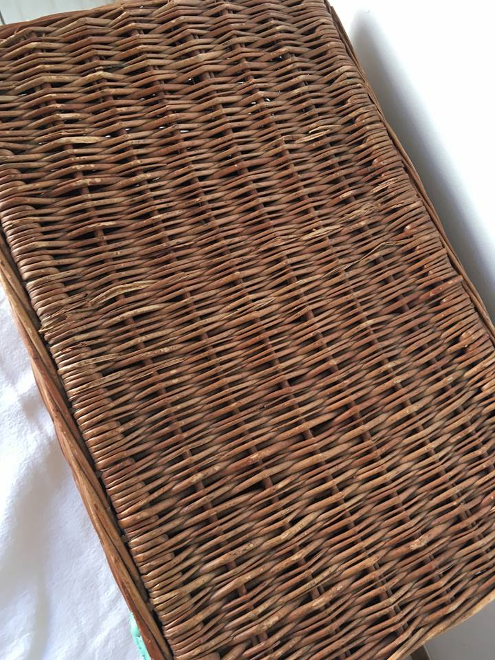 Wicker suitcase to store toys.