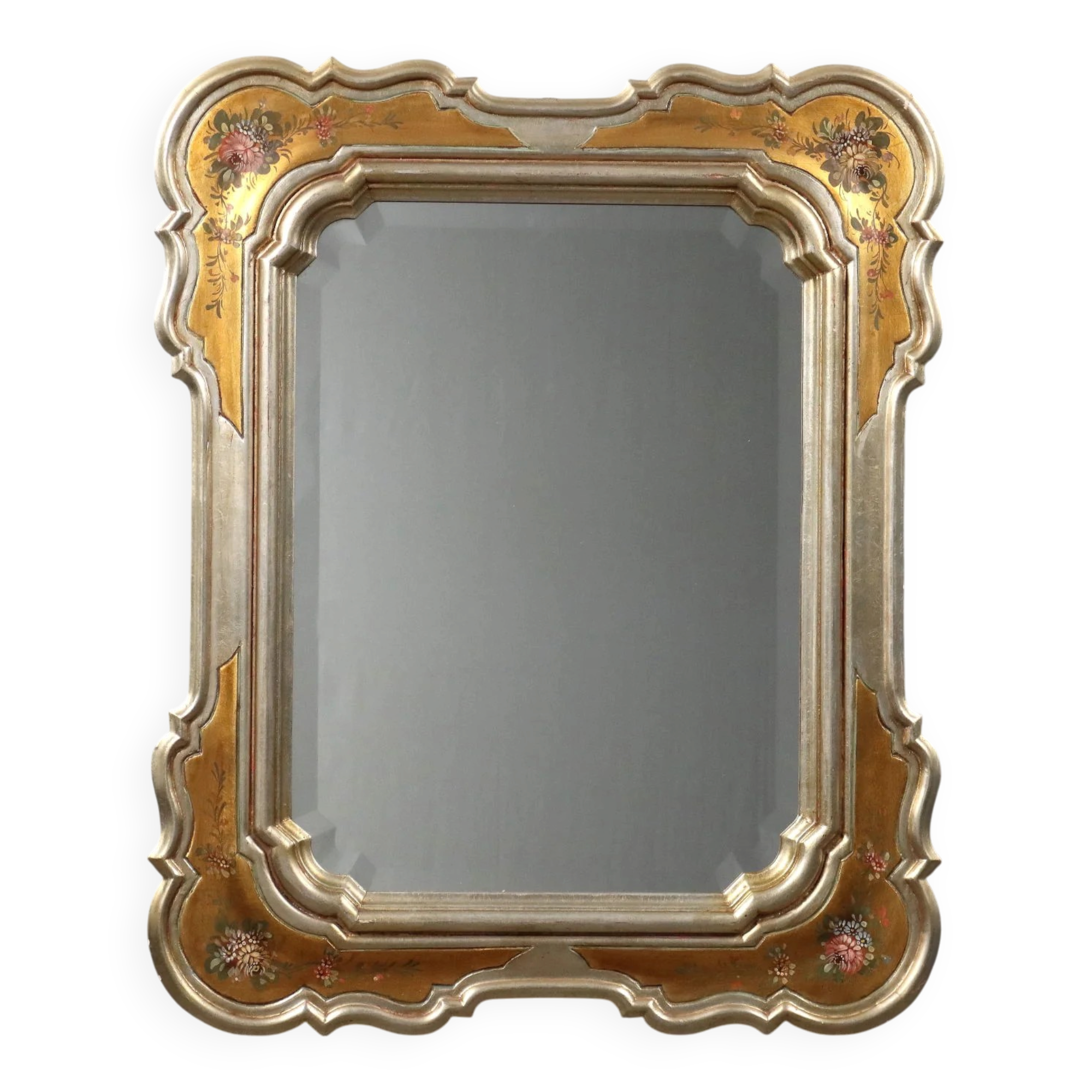 Antique mirror with a gilded frame and floral decorations, Italy, 20th century.