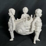 Porcelain, centerpiece with candle holder decorated with putti, 20th century