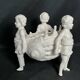 Porcelain, centerpiece with candle holder decorated with putti, 20th century