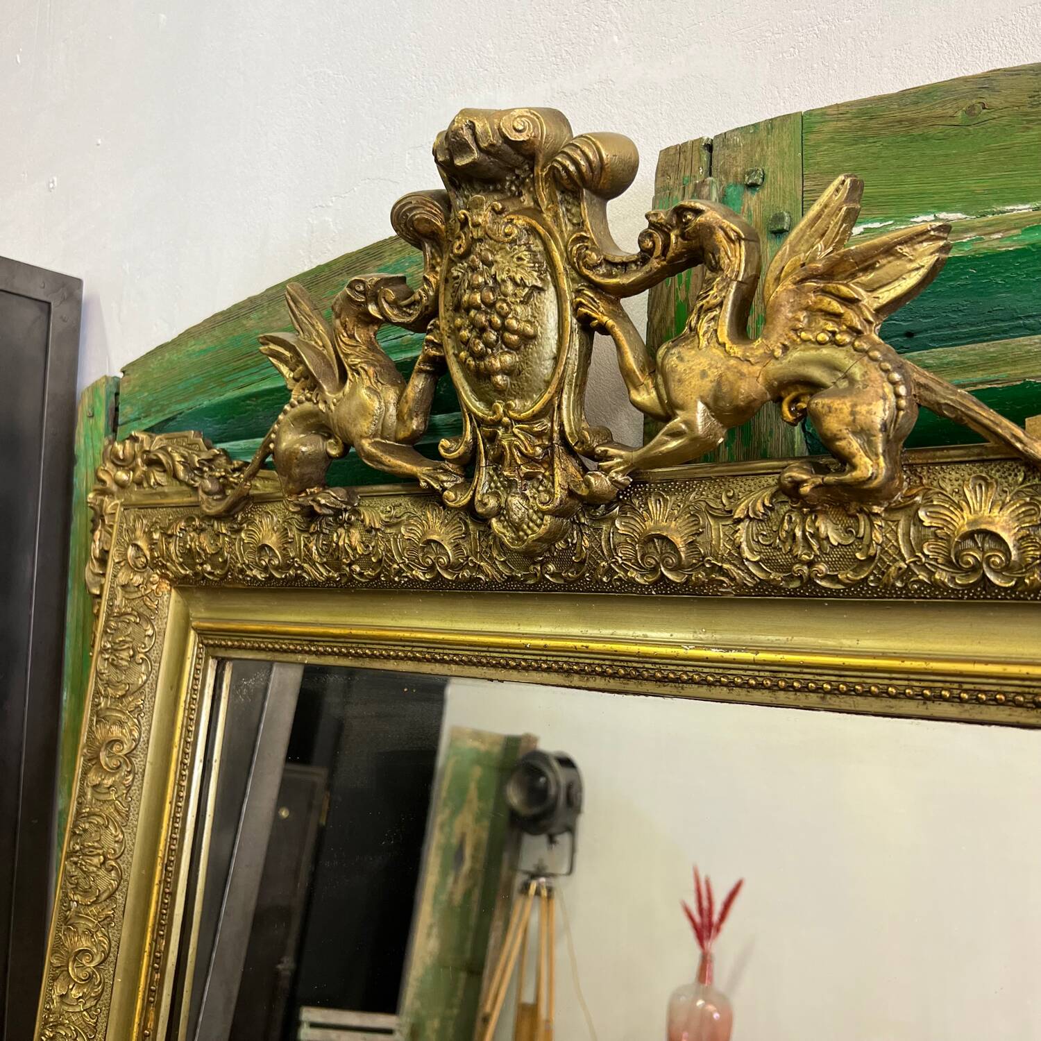 Old Napoleon III mirror decorated with a griffin