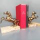 Pair of art deco bookends in bronze and marble