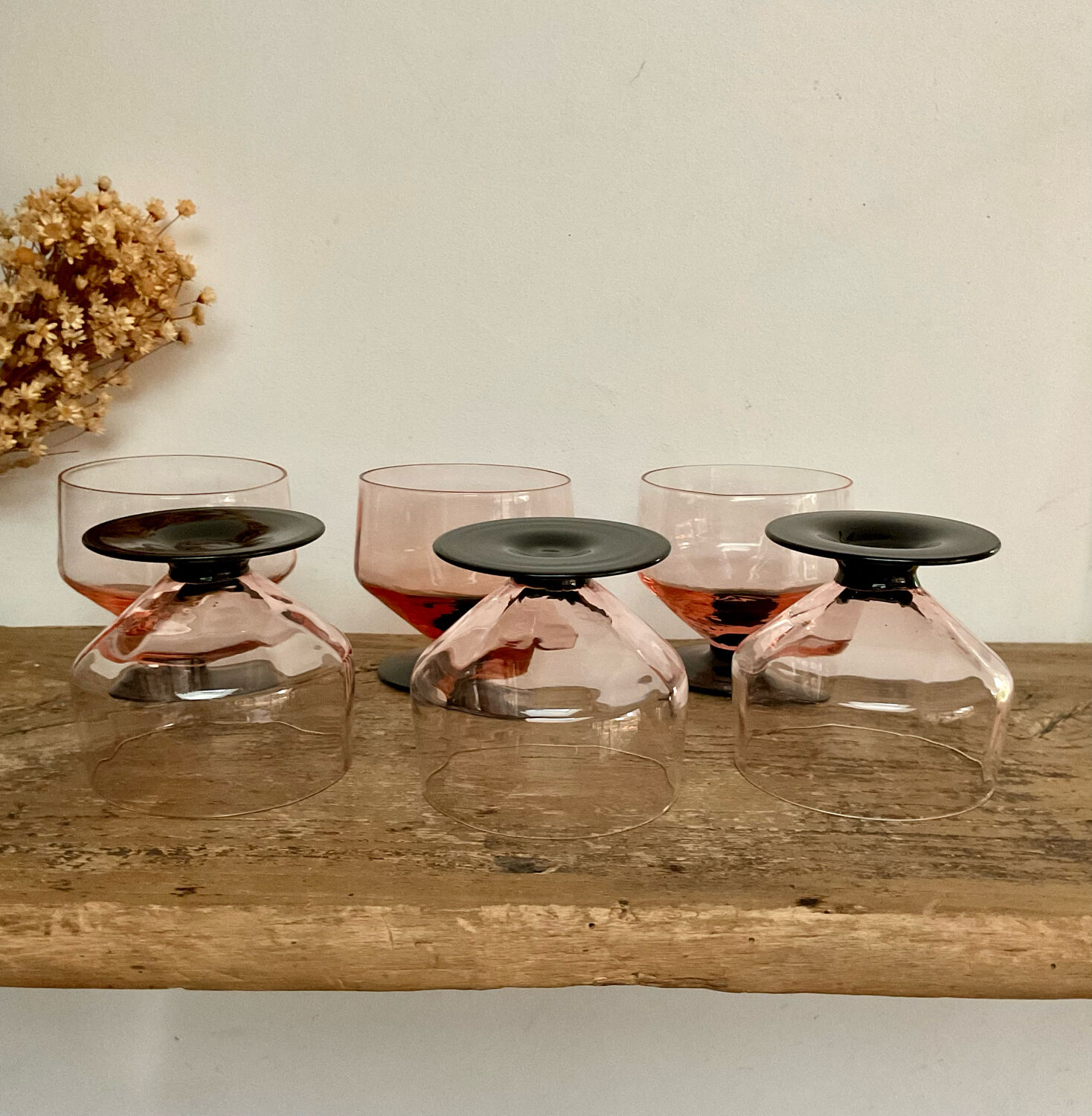 6 pink bowls with black stems
