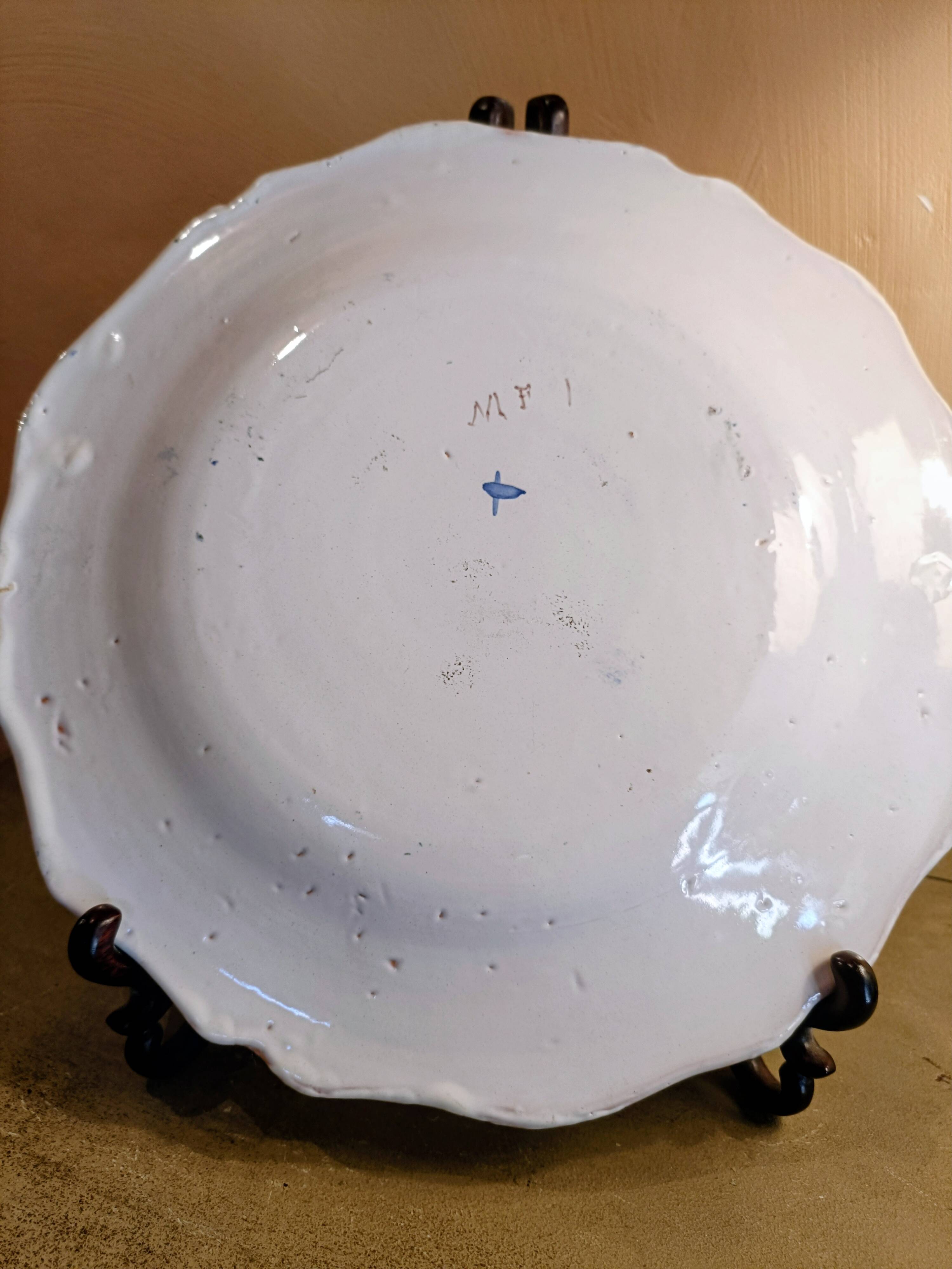 Old Moustiers faience plate blue and white with blue ibis decoration.