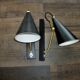 Pair of modernist sconces in black and gold metal