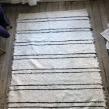 Simple carpet in ecru recycled cotton with black stripes of Berber type