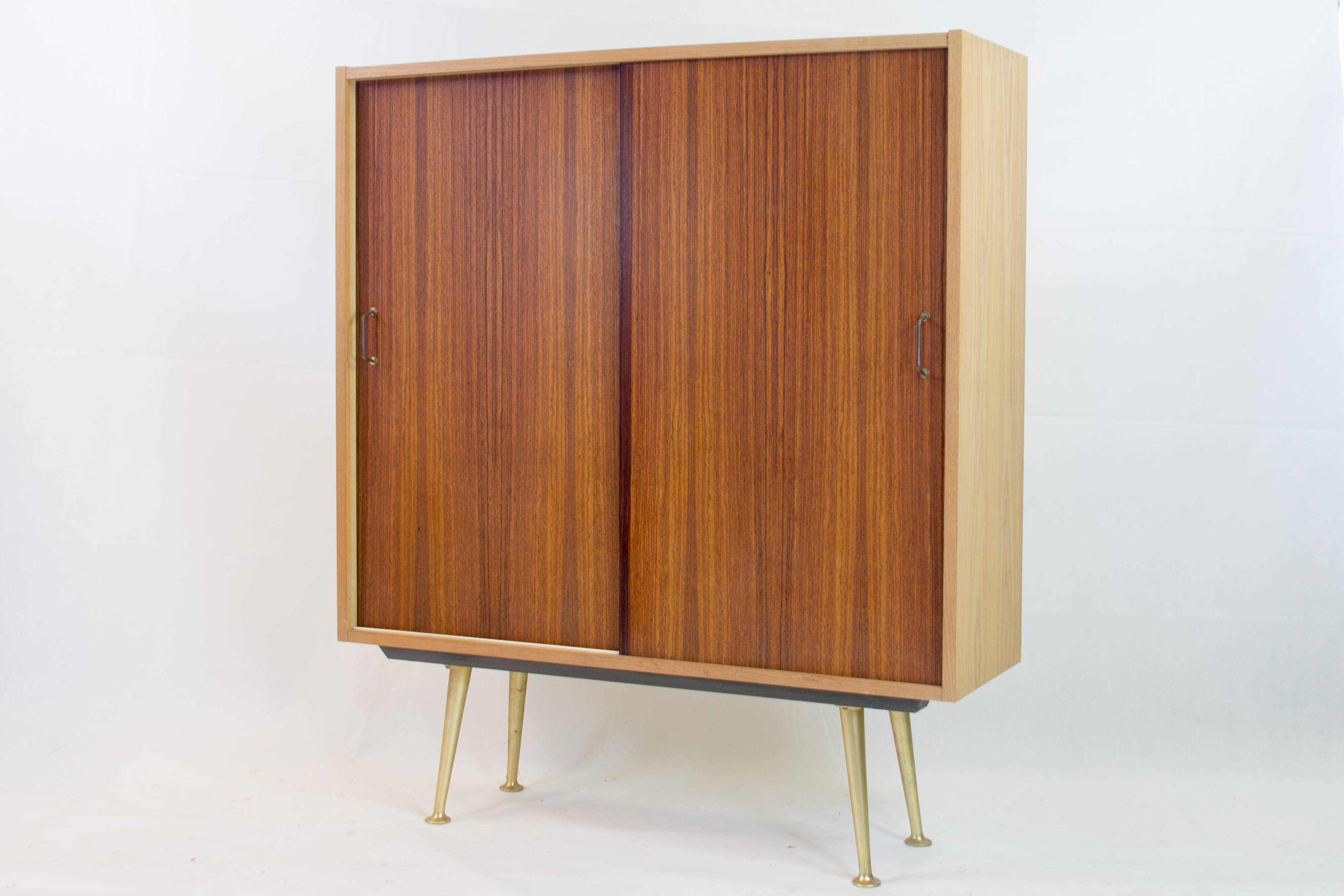 Wardrobe with sliding doors by Deutsche Werkstätten München