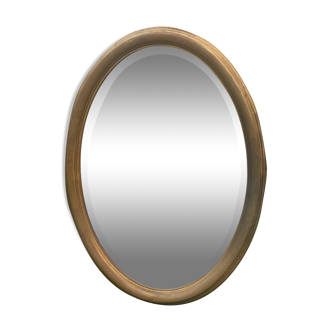 Bevelled golden oval mirror, 79 x 59 cm