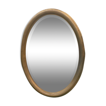 Bevelled golden oval mirror, 79 x 59 cm