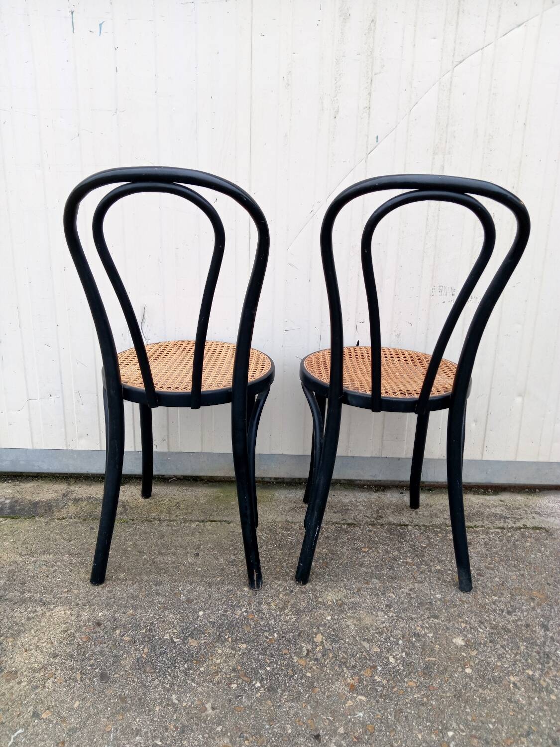 Pair of fmg bentwood and cane bistro chairs