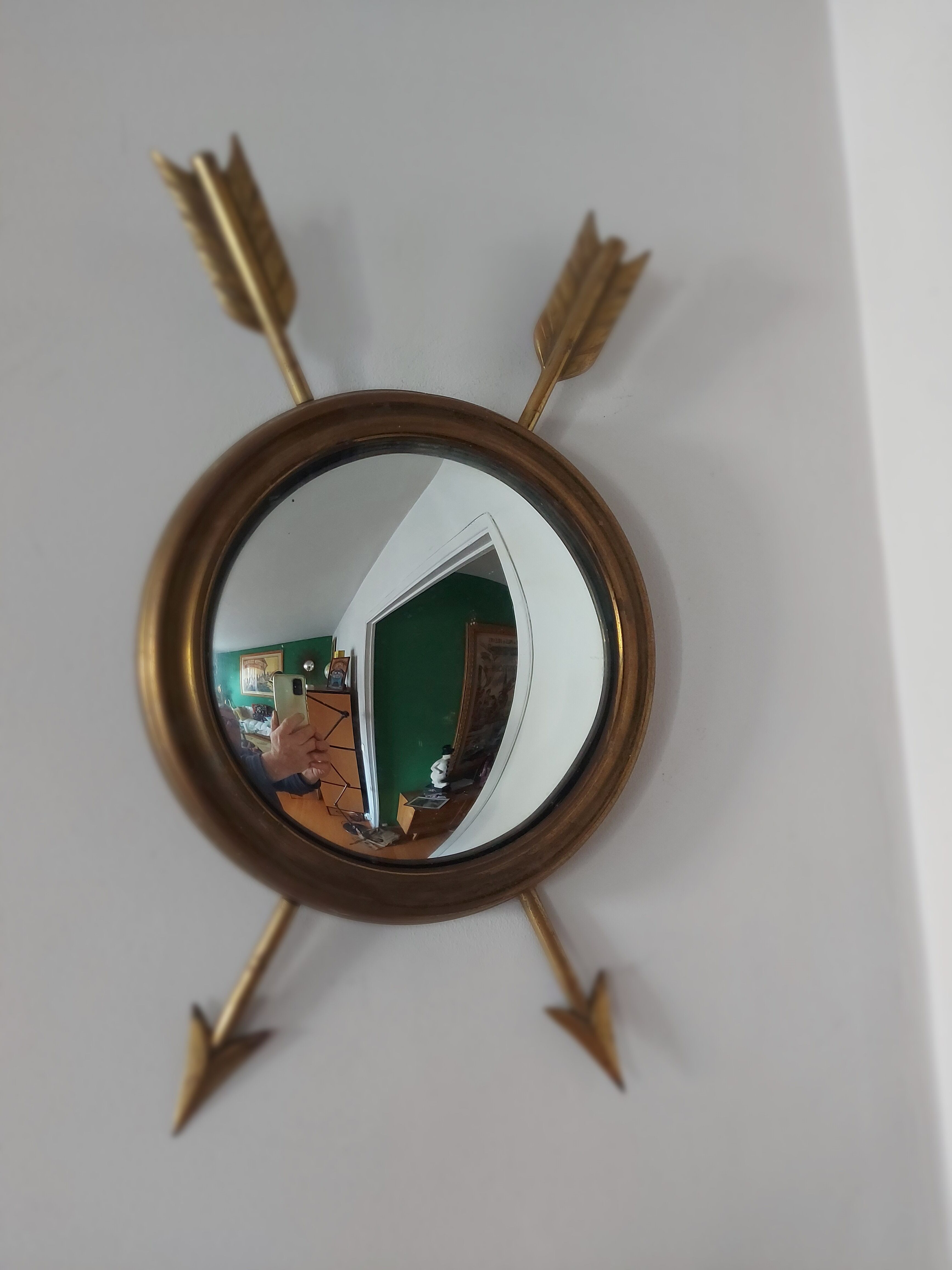 Curved brass witch's mirror
