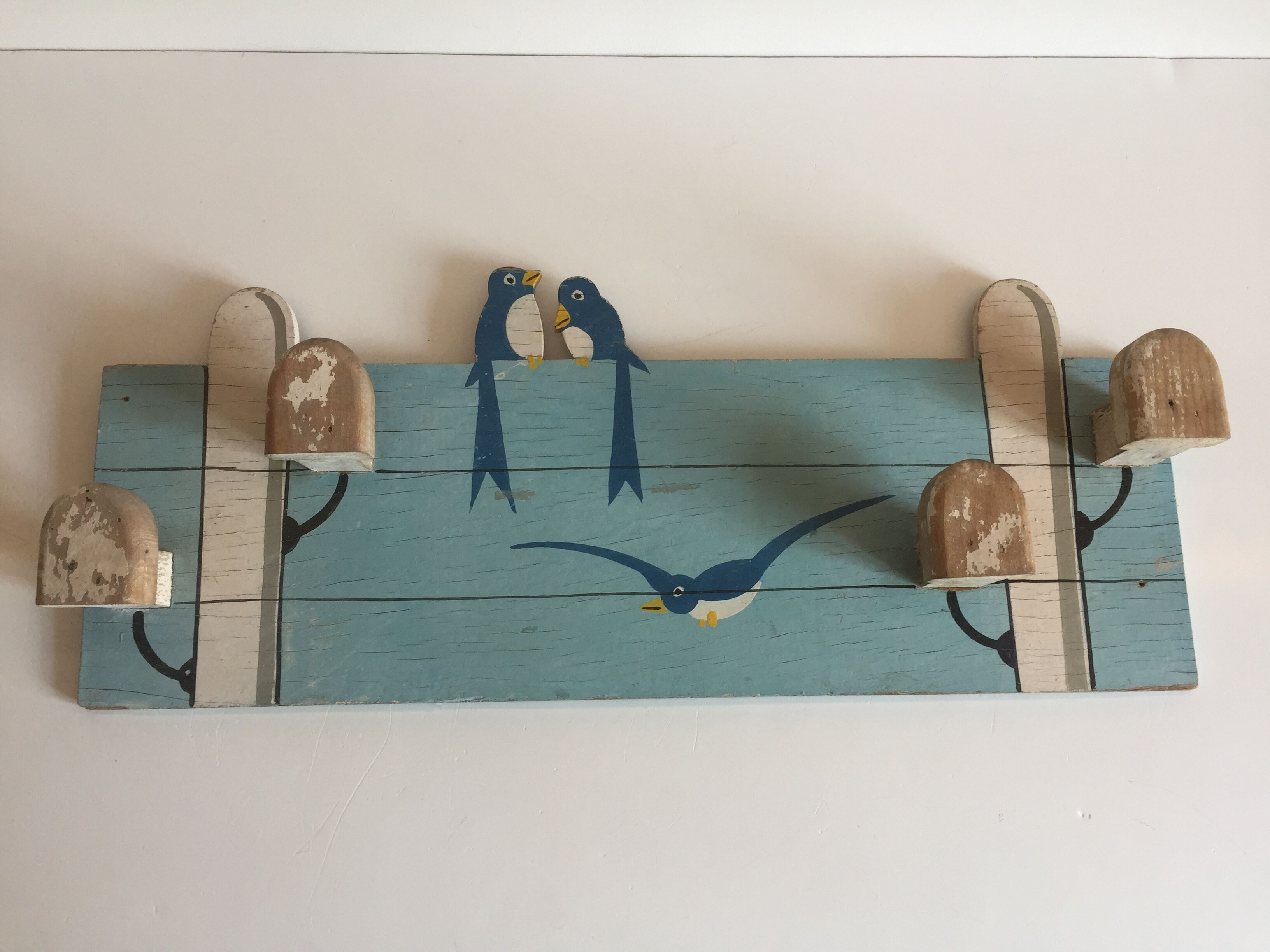 Coat rack with vintage swallows
