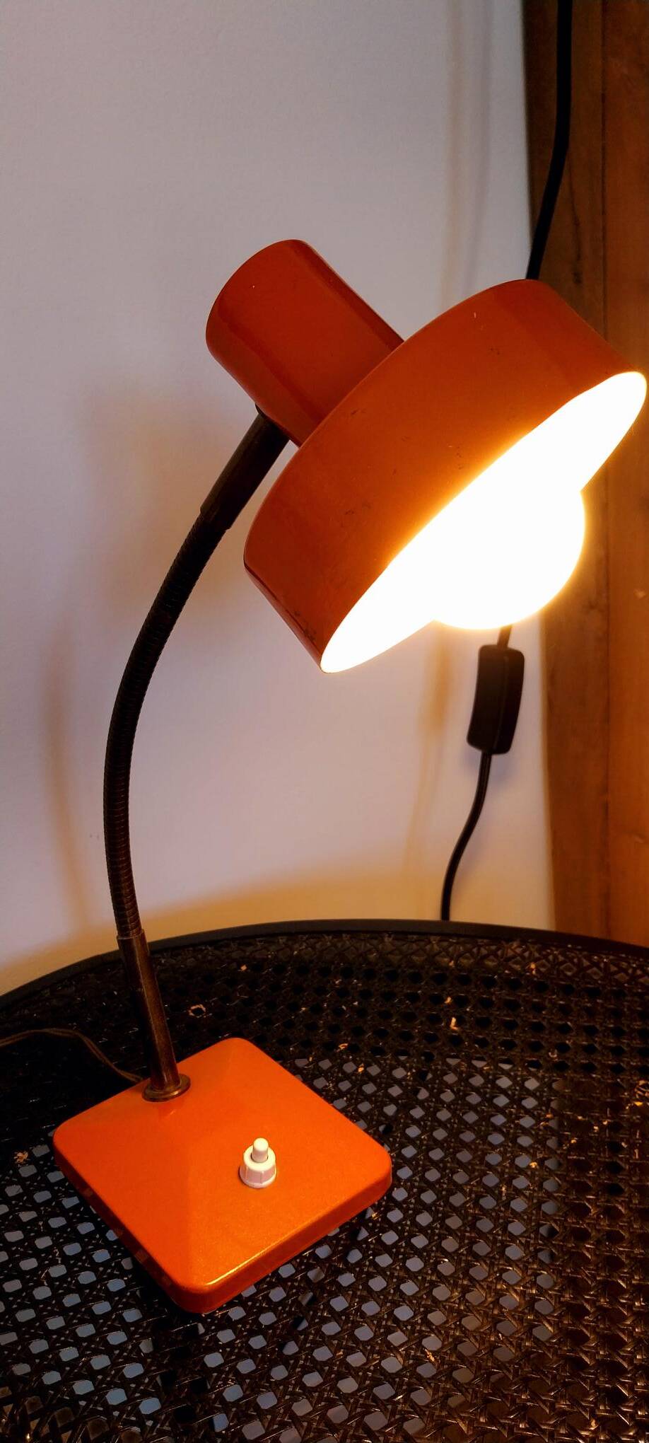 Orange metal lamp from the 60s and 70s.