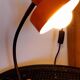 Orange metal lamp from the 60s and 70s.