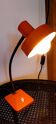 Orange metal lamp from the 60s and 70s.