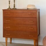 Vintage 1960s chest of drawers with covered handles.