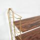Wood-coloured metal string shelf and gold double studs 1960
