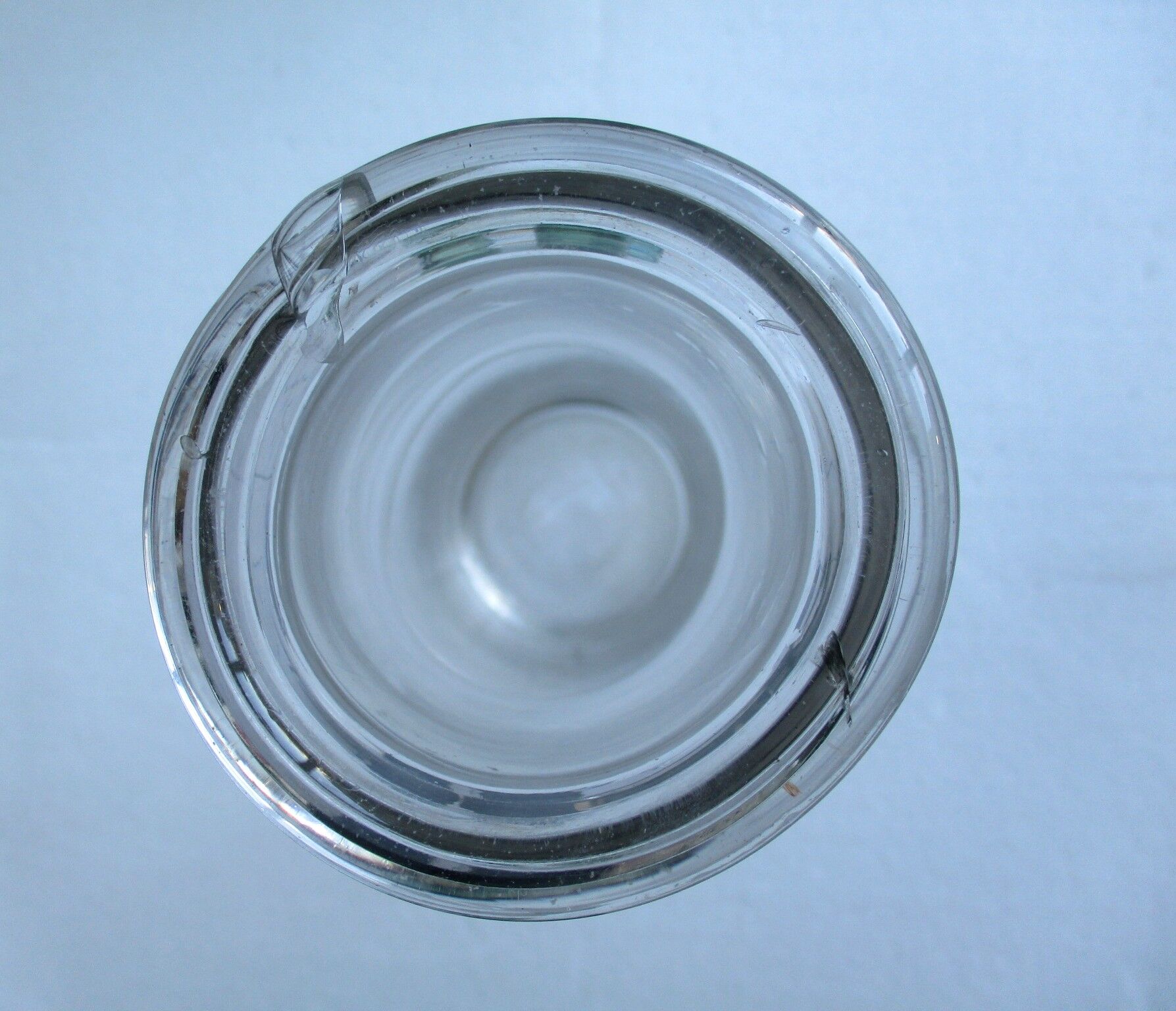 Large antique bottle made of blown glass