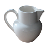 Old pitcher in white earthenware