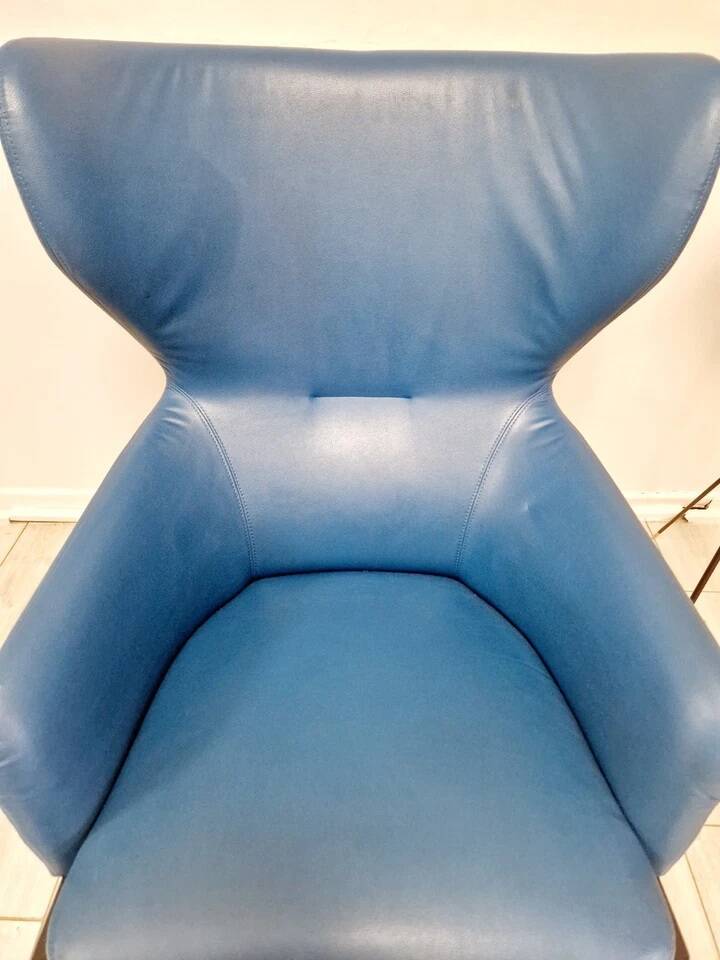 High-back armchair by Rodolfo Dordoni